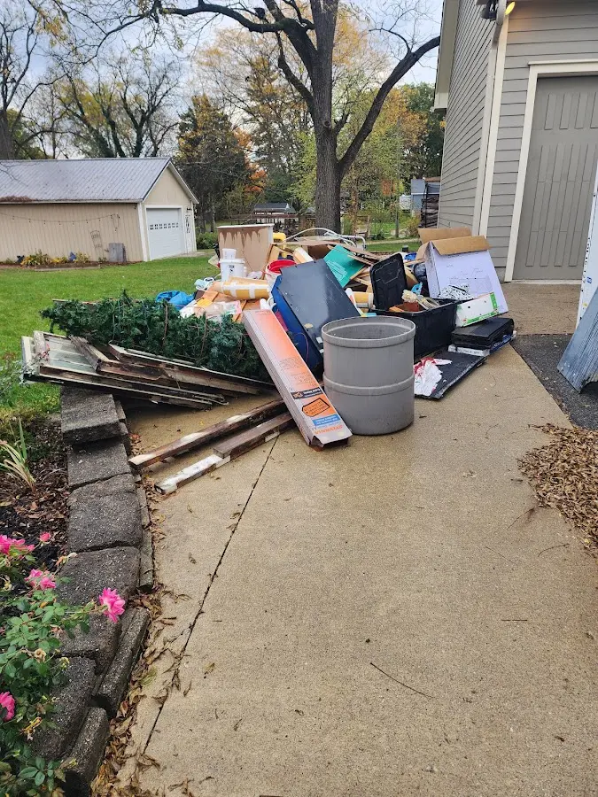 Dumpster being loaded with debris for Commercial Dumpster Rental in Patterson